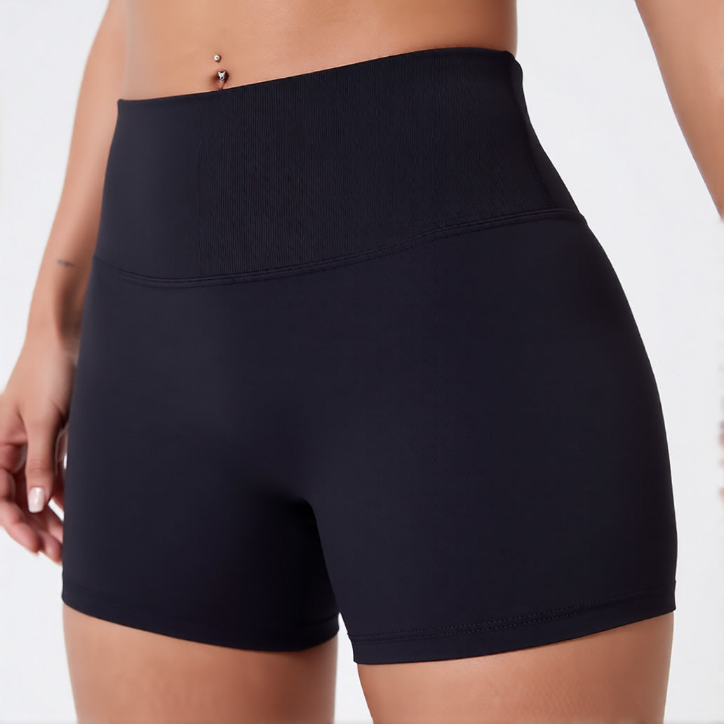 Women's high waisted gym shorts in black, showcasing the secure wide waistband and athletic performance silhouette | color:black