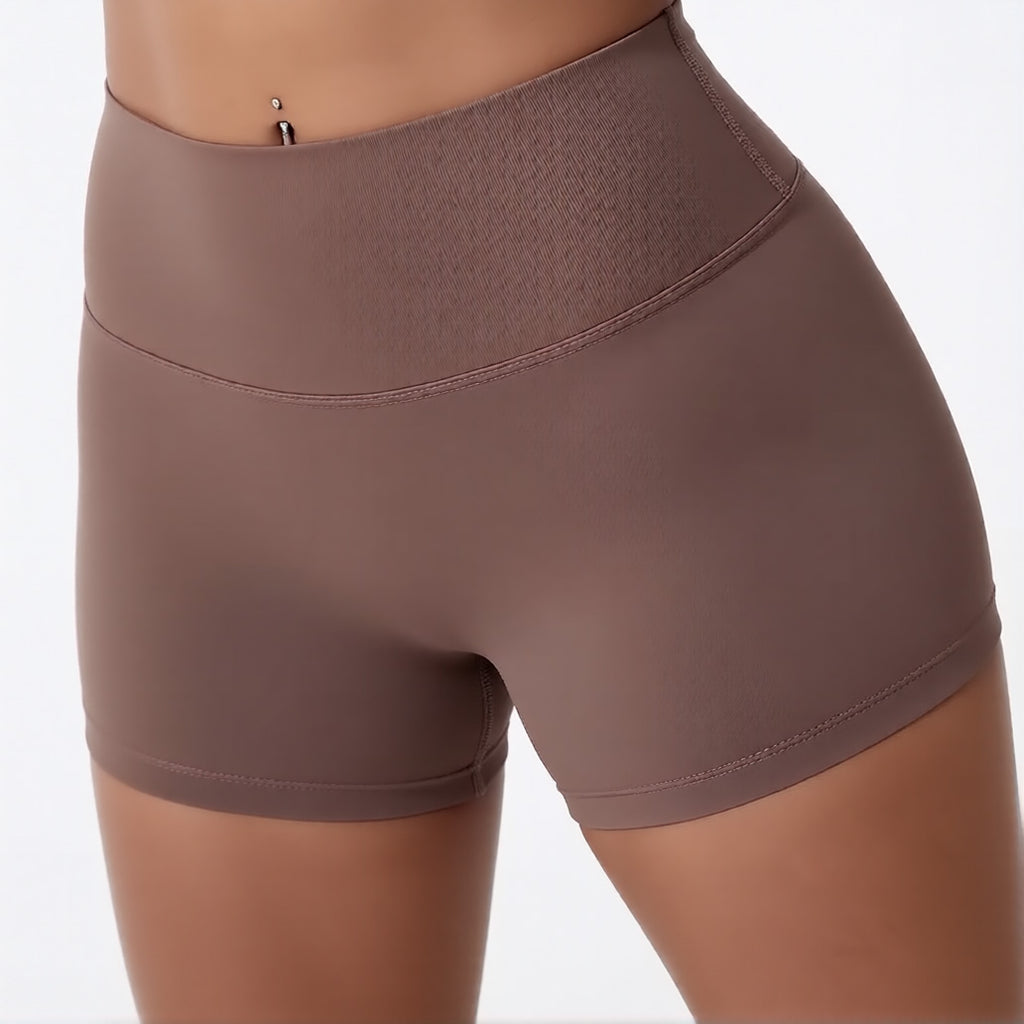 Women's high waisted gym shorts in brown, showcasing the secure wide waistband and athletic performance silhouette | color:brown