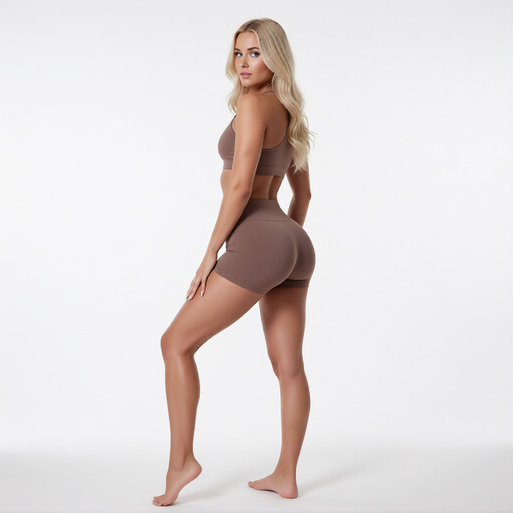 Women's high waisted gym shorts in brown, rear view showcasing the secure wide waistband and athletic performance silhouette | color:brown