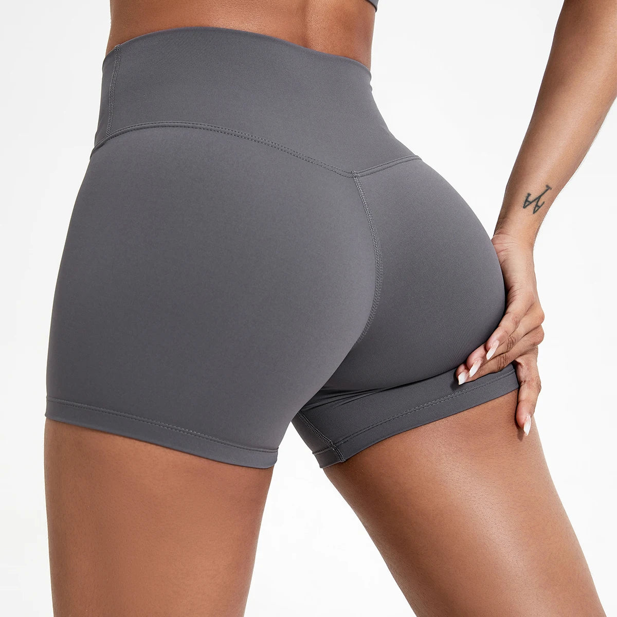 Women's high waisted gym shorts in grey, rear detail view showcasing the secure wide waistband and seam contruction | color:grey