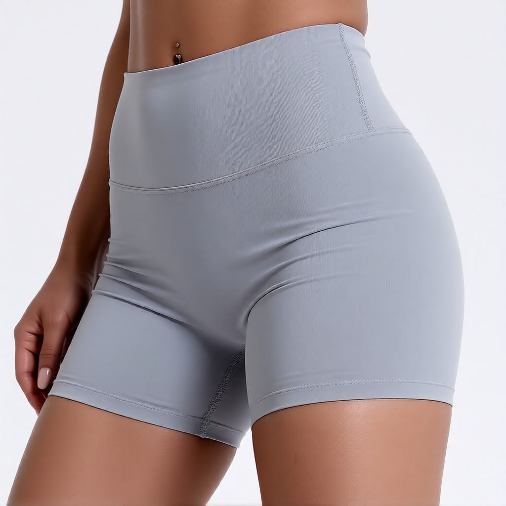 Women's high waisted gym shorts in light grey, showcasing the secure wide waistband and athletic performance silhouette | color:light grey