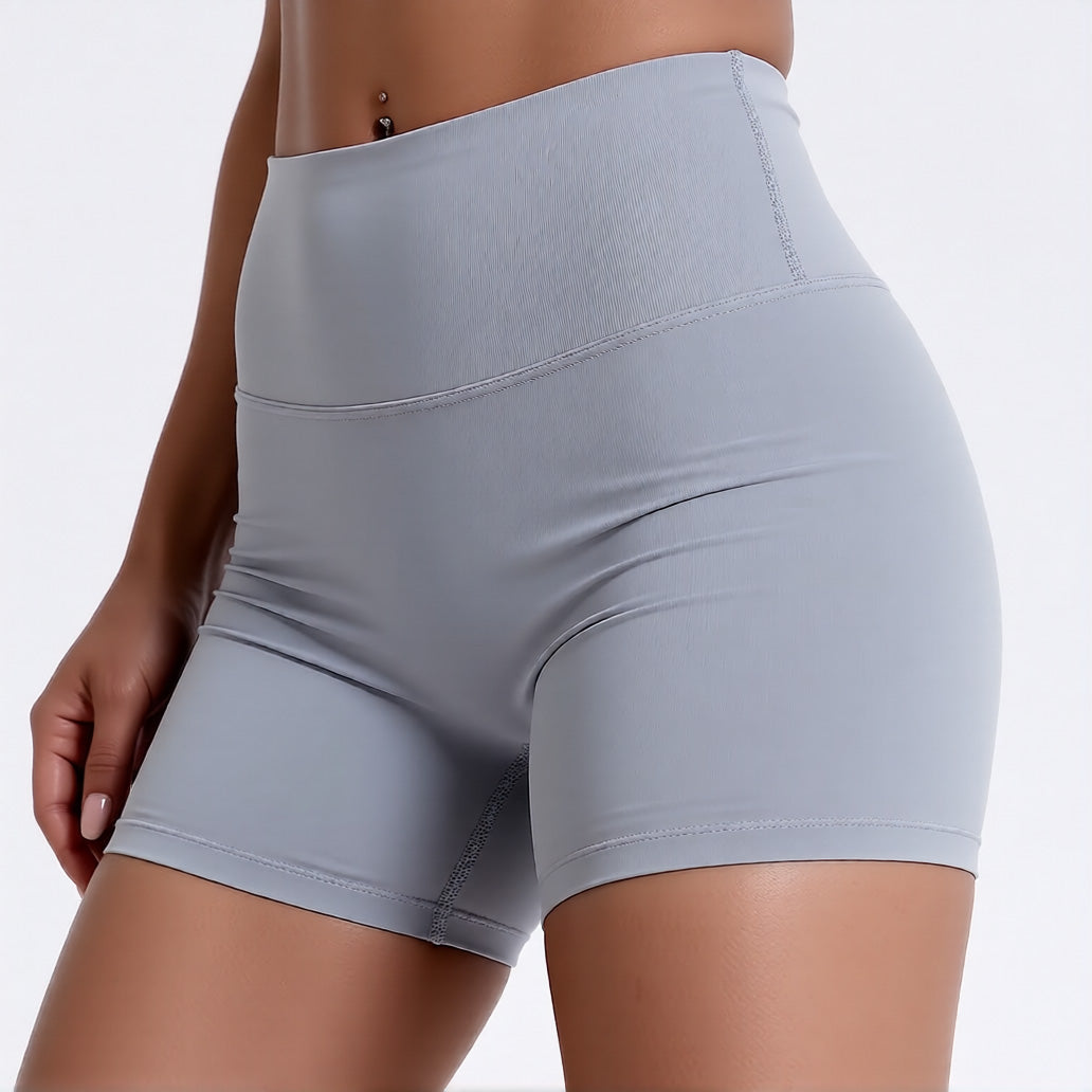 Women's high waisted gym shorts in light grey, showcasing the secure wide waistband and athletic performance silhouette | color:light grey