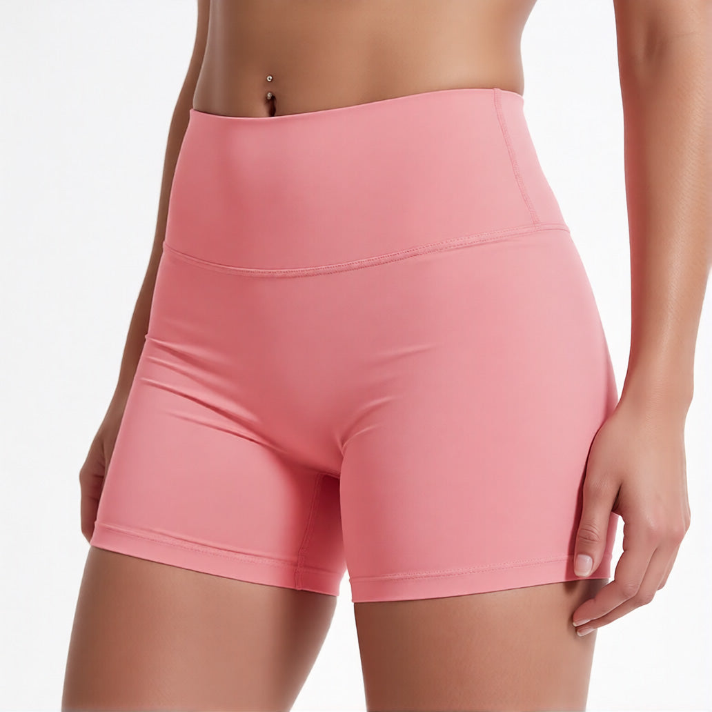 Women's high waisted gym shorts in pink, showcasing the secure wide waistband and athletic performance silhouette | color:pink