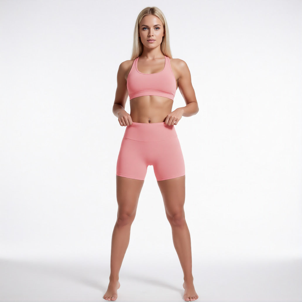 Women's high waisted gym shorts in pink, front view showcasing the athletic performance silhouette | color:pink