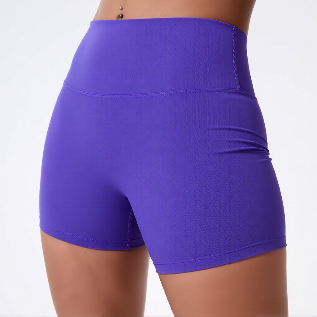 Women's high waisted gym shorts in purple, showcasing the secure wide waistband and athletic performance silhouette | color:purple