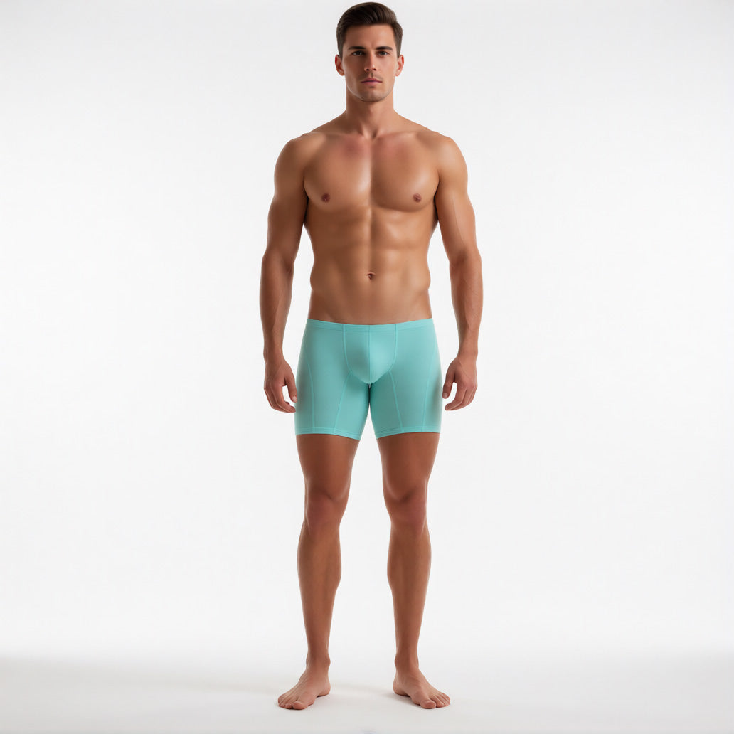 long leg boxer briefs in blue, full body image showing the extended leg length and ultra-thin, sheer performance fabric | color:blue