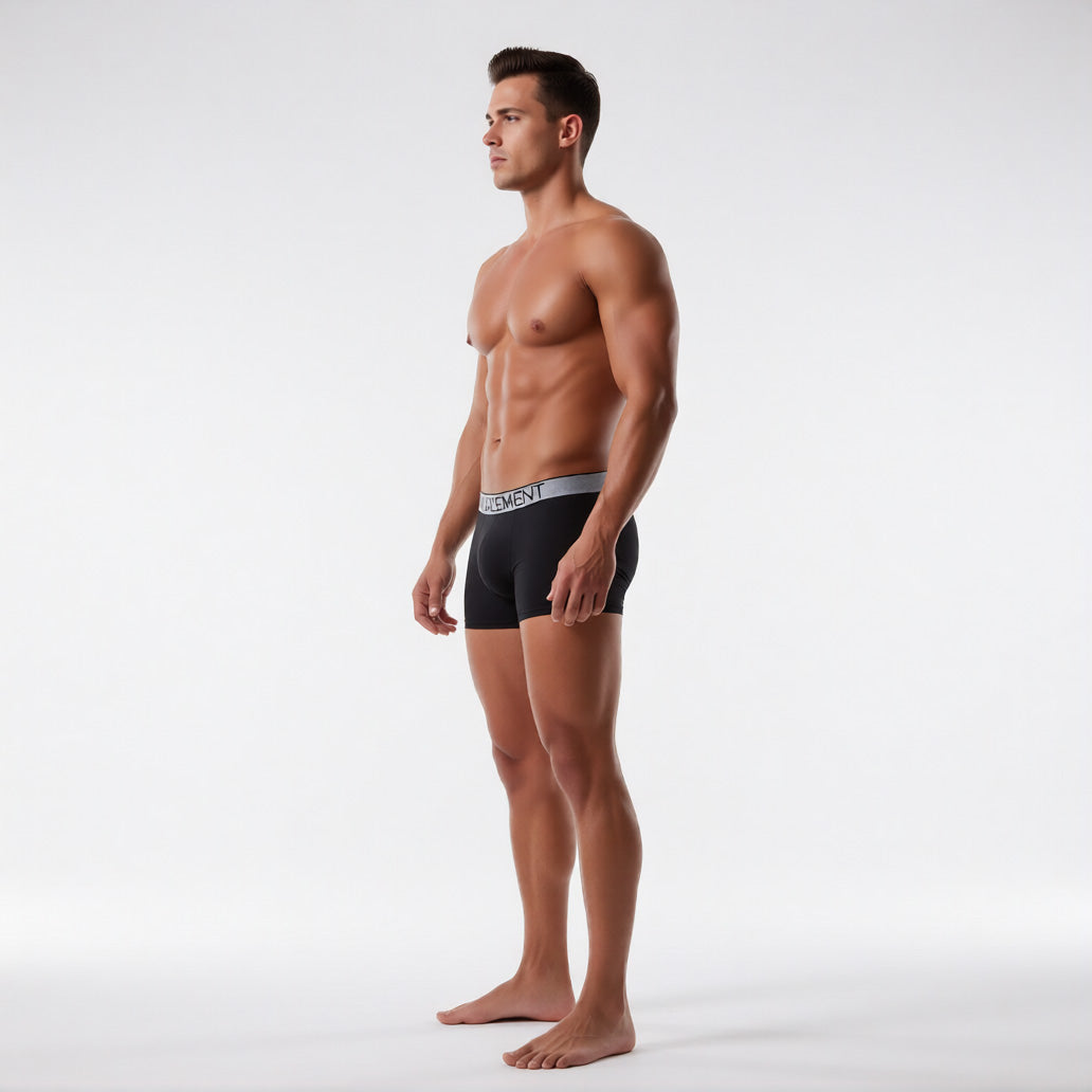 Men's boxer briefs with ball pouch in black, side profile showing the contoured support pouch and premium Modal texture | color:black