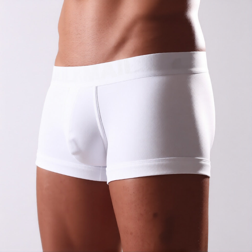 Men's C-ring boxer briefs in white in front three quarter view, showing the enhancing support pouch and comfort waistband | color:white