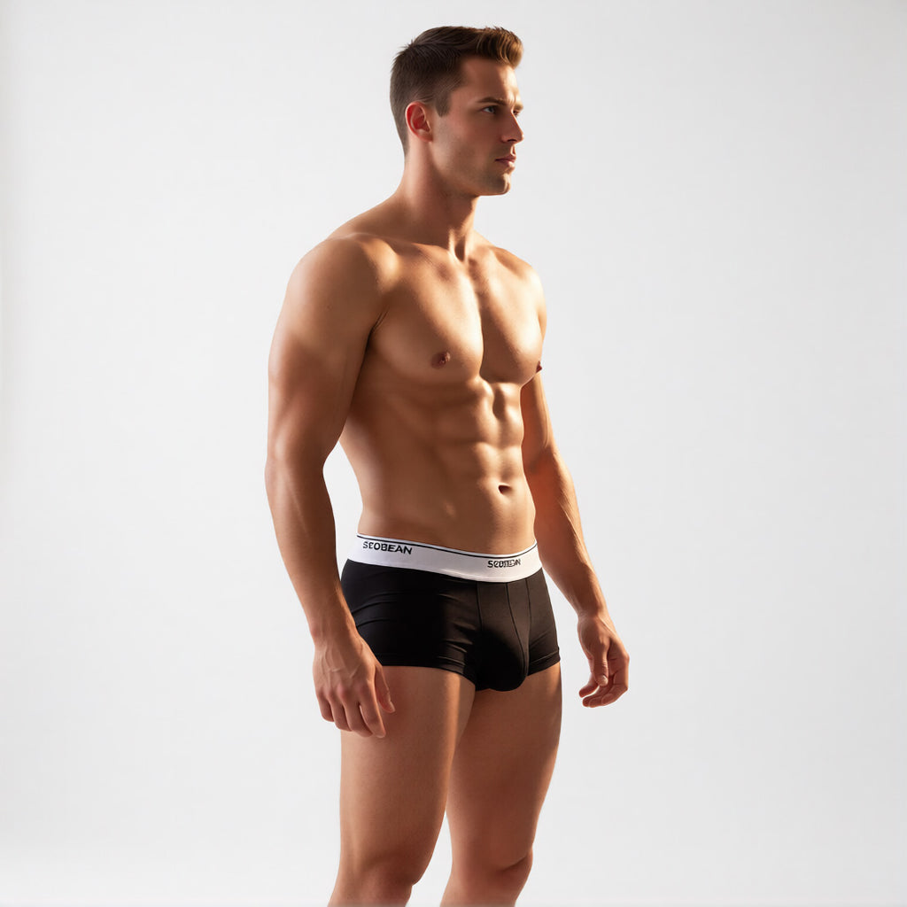 Men's designer trunks in classic black, side profile highlighting the wide branded waistband and enhancing support pouch | color:black