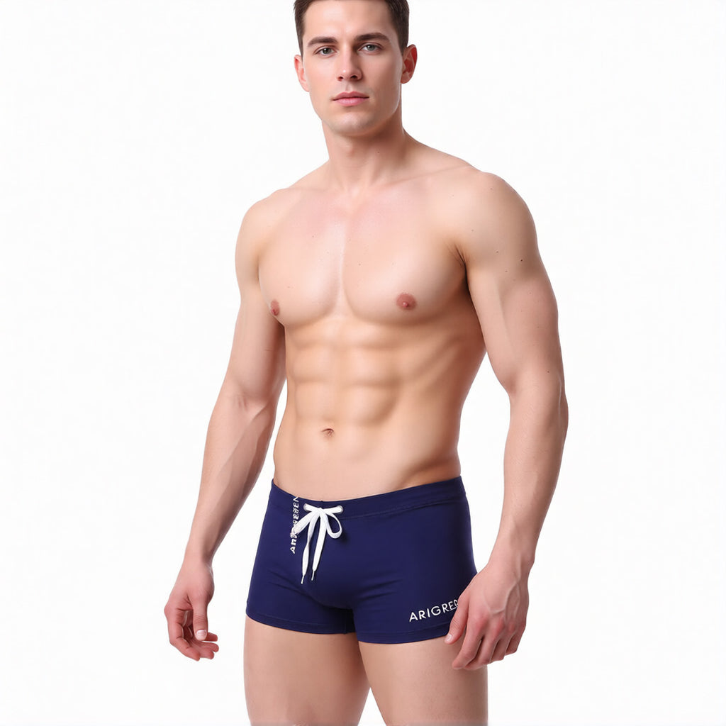 men's square cut swim trunks in navy showing the low rise and athletic fit | color:navy