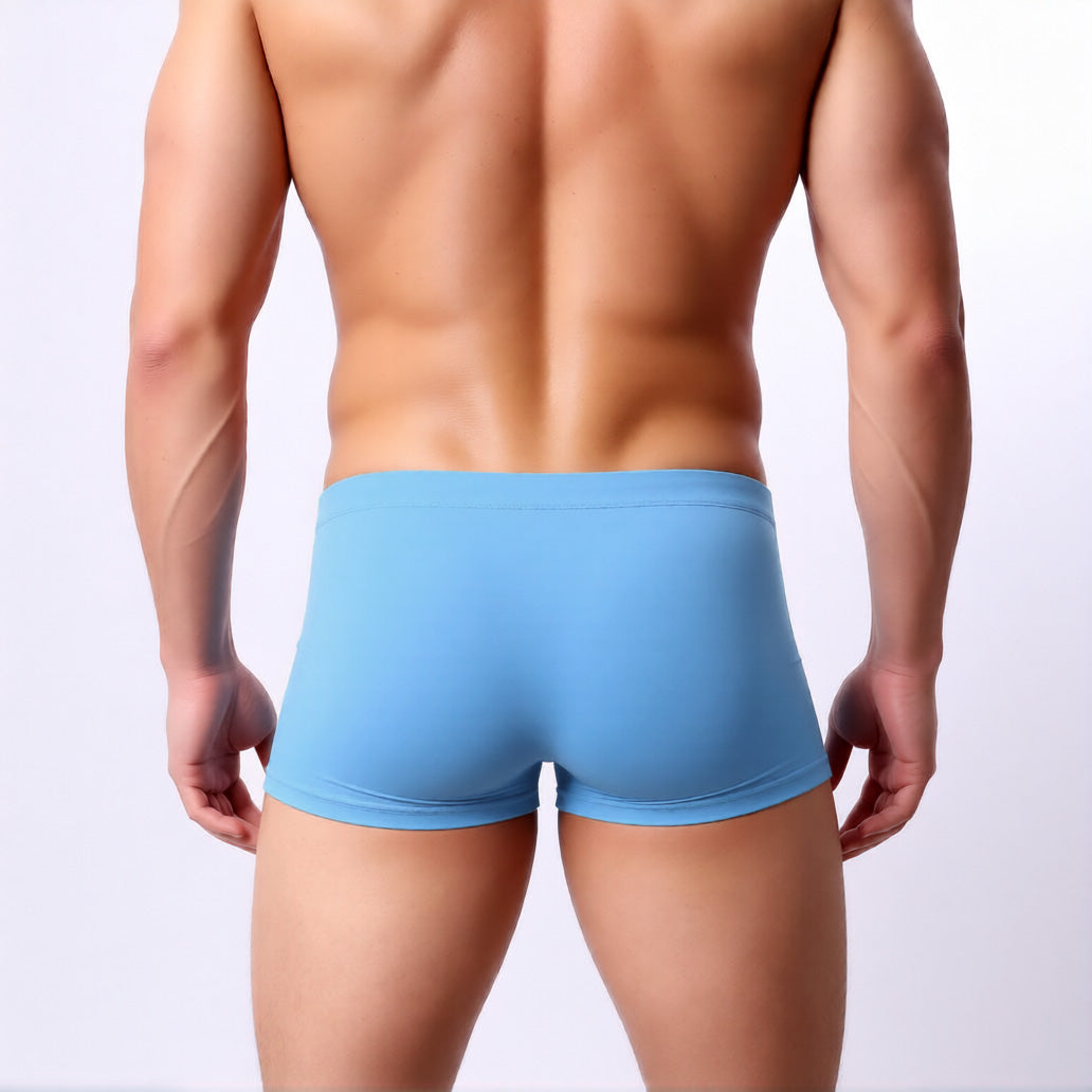men's square leg swimsuit showing the low rise and athletic fit from the rear | color:sky blue