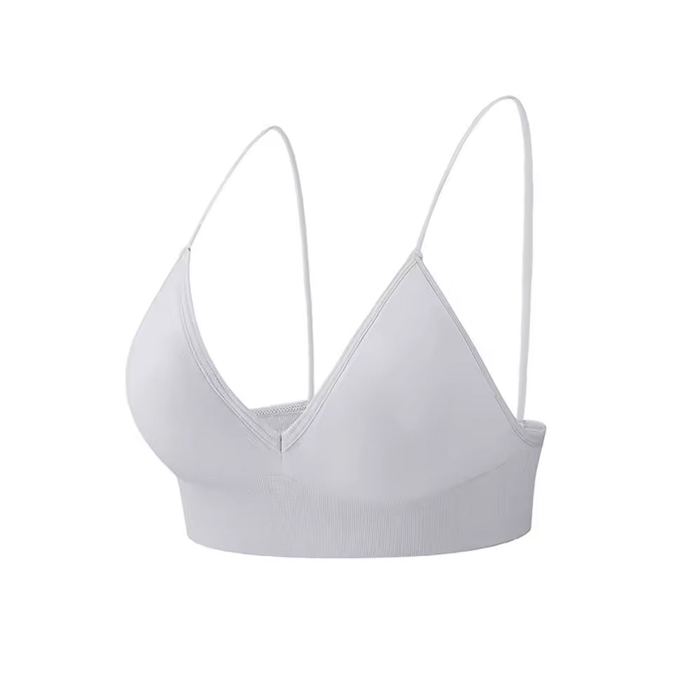 seamless bralette in grey with thin straps on a white background |color:grey