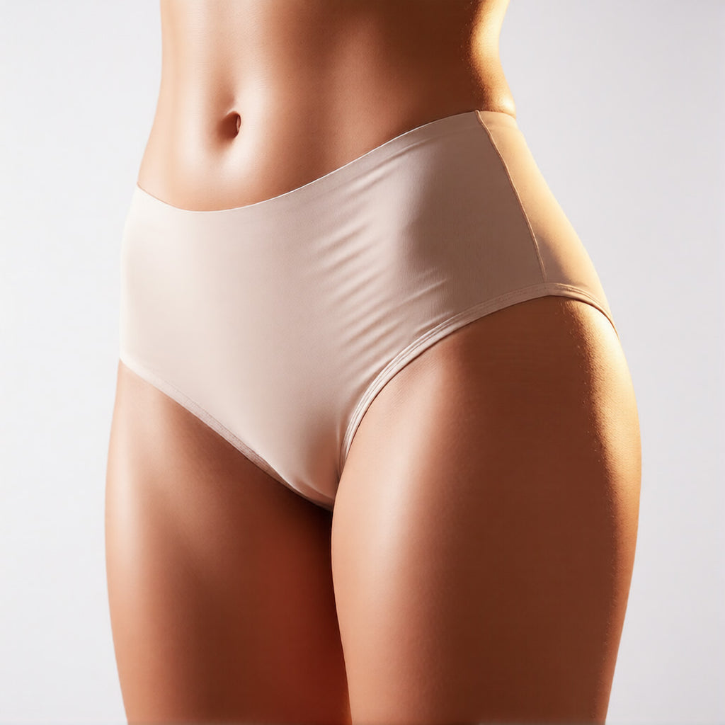 Seamless ice silk panties in nude color shown from a front three quarter profile, featuring a mid-rise fit and no show construction. | color:nude